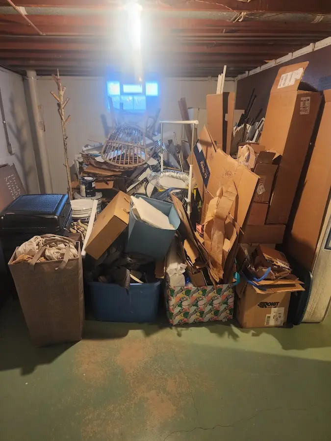 Roll-off dumpster container at job site for 2 Yard Dumpster Rental in Algonac